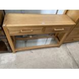 A MODERN OAK CONSOLE TABLE WITH TWO DRAWERS AND LOWER GLAZED SHELF 48" WIDE