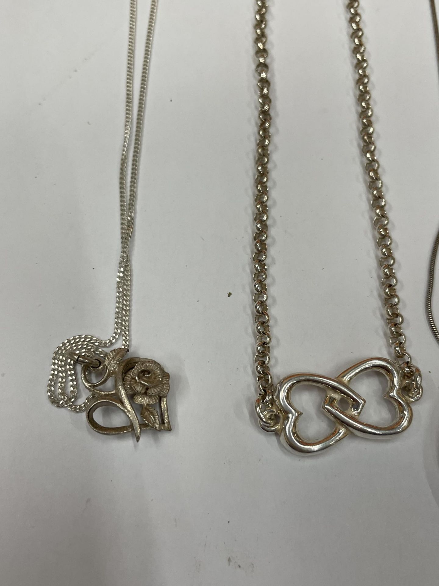 FOUR SILVER NECKLACES WITH PENDANTS - Image 2 of 3