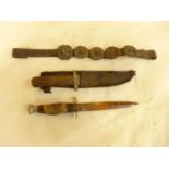 A SHEATH KNIFE AND LEATHER SCABBARD, 15CM BLADE, ANOTHER KNIFE AND A LEATHER STRAP (3)
