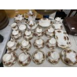A LARGE COLLECTION OF ROYAL ALBERT OLD COUNTRY ROSES TO INCLUDE TRIOS, CAKE PLATE, SANDWICH PLATES
