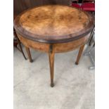 A REPRODUCTION BURR WALNUT FOLDER TABLE WITH TAPERED LEGS SPADE FEET AND APPLIED GILT METALWARE