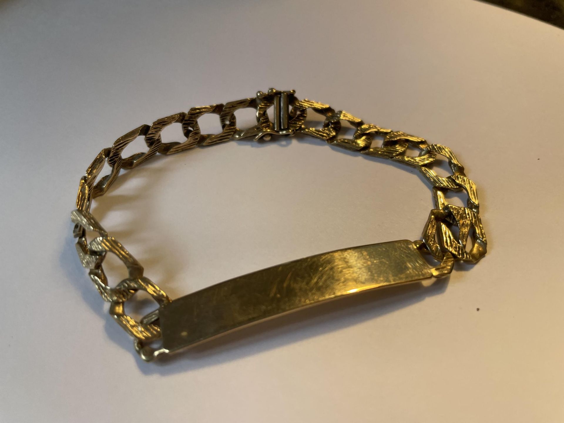 A 9 CARAT GOLD IDENTITY BRACELET MARKED 375 GROSS WEIGHT 12 GRAMS