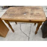 A MODERN PINE OCCASIONAL TABLE ON TURNED LEGS, WITH CANTED CORNERS, 36X21"