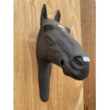 A BLACK PLASTIC HORSES HEAD