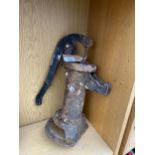 A VINTAGE MINITURE CAST IRON WATER PUMP