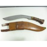 A LARGE KUKRI KNIFE AND SCABBARD, 33CM BLADE STAMPED WITH MILITARY BROAD ARROW AND DATE 1917