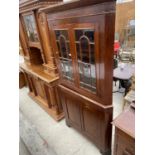A MAHOGANY FULL LENGTH CORNER CUPBOARD WITH GLAZED UPPER PORTION AND CUPBOARDS TO THE BASE, 41" WIDE