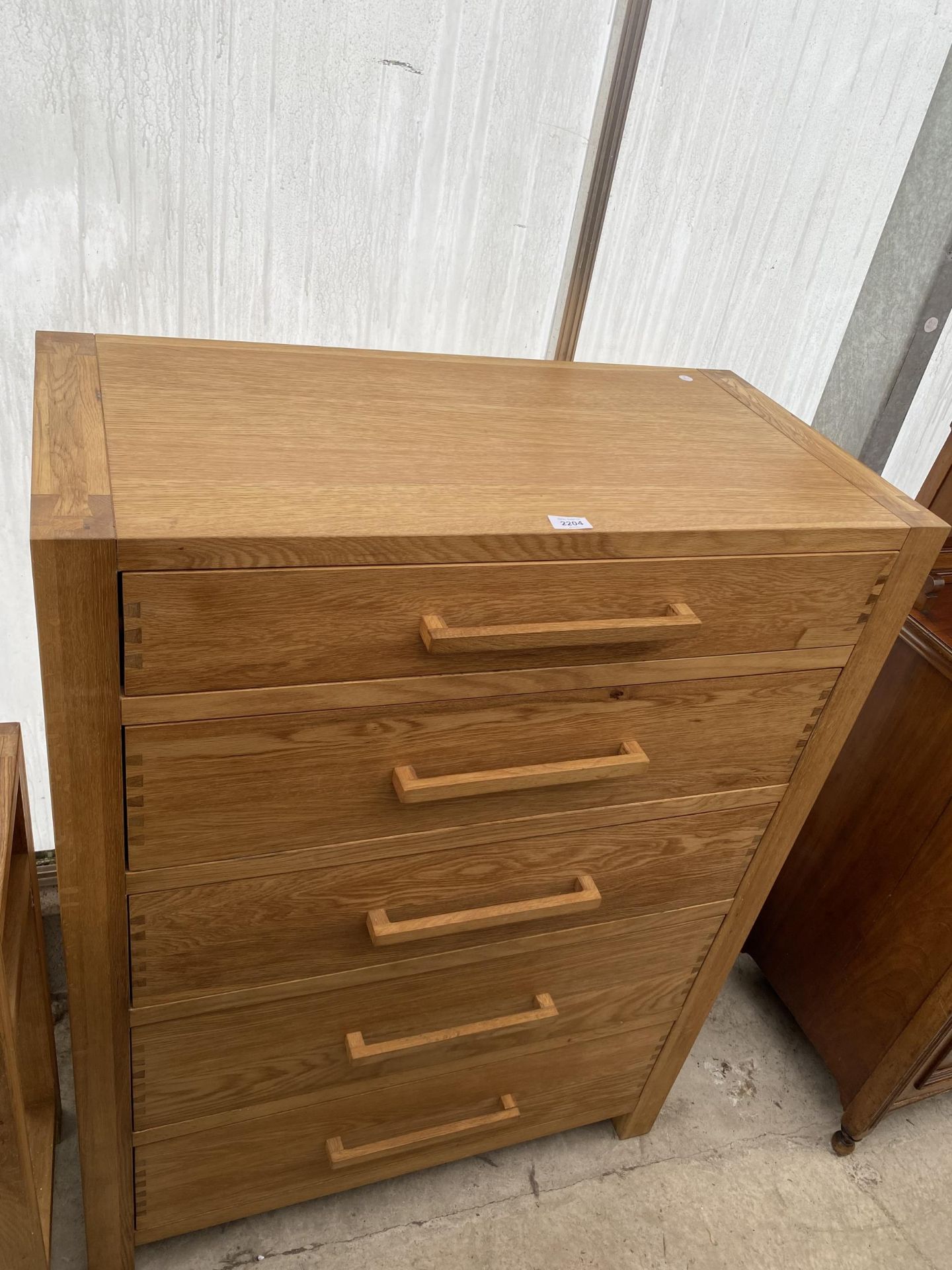 A MODERN OAK CHEST OF FIVE DRAWERS 35.5" WIDE
