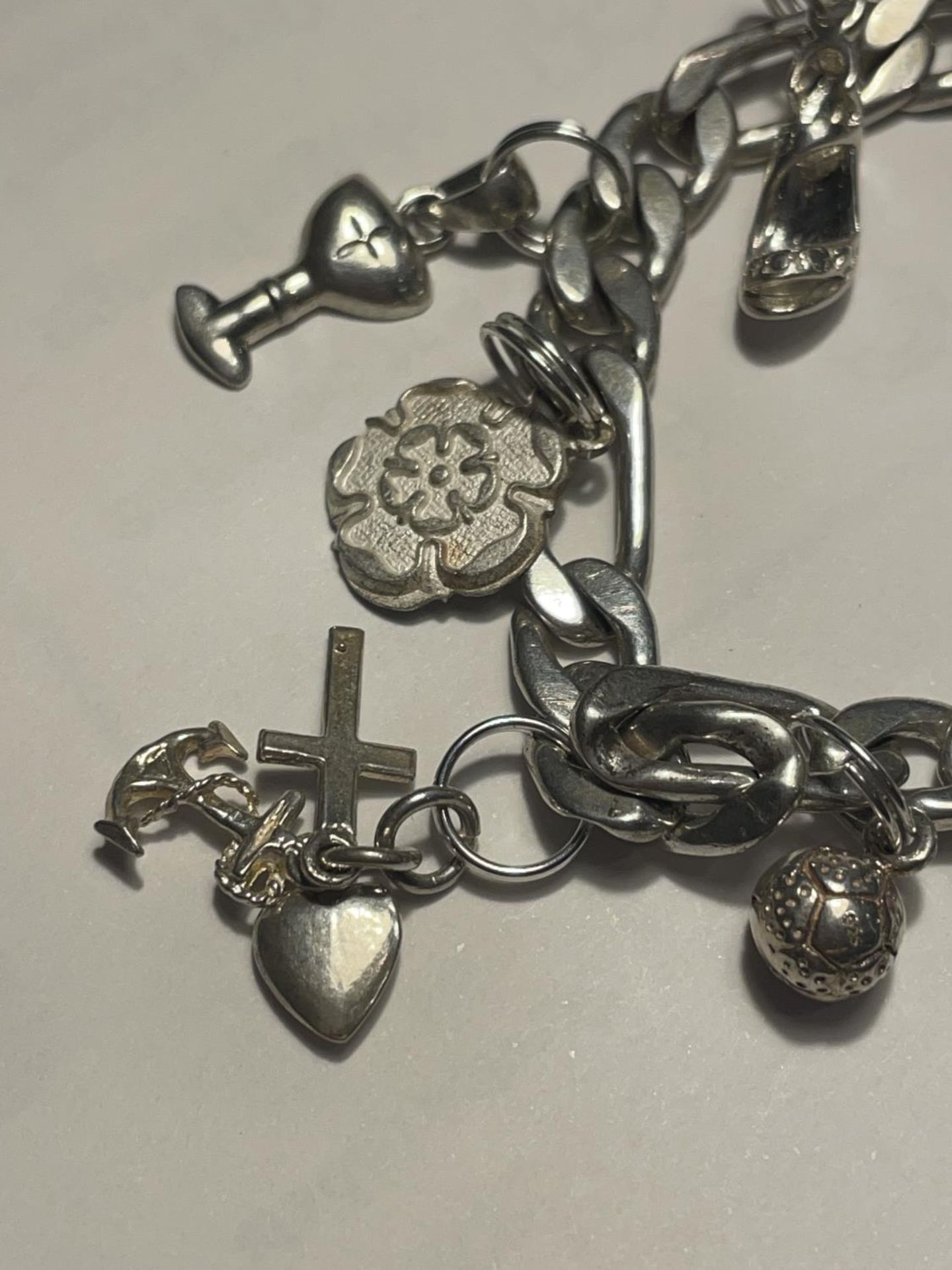 A SILVER CHARM BRACELET WITH HEART PADLOCK AND ELEVEN CHARMS - Image 2 of 4