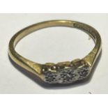 AN 18 CARAT GOLD RING WITH THREE IN LINE DIAMONDS SIZE J GROSS WEIGHT 1.96 GRAMS