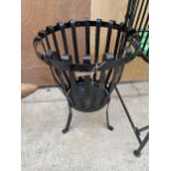 A SMALL METAL GARDEN FIRE PIT