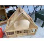 A WOODEN CHILDS PLAY BUILDING