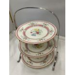 A CHROME CAKE STAND WITH THREE ROYAL DOULTON FLORAL PLATES