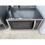 A KENWOOD MICROWAVE OVEN BELIEVED IN WORKING ORDER BUT NO WARRANTY