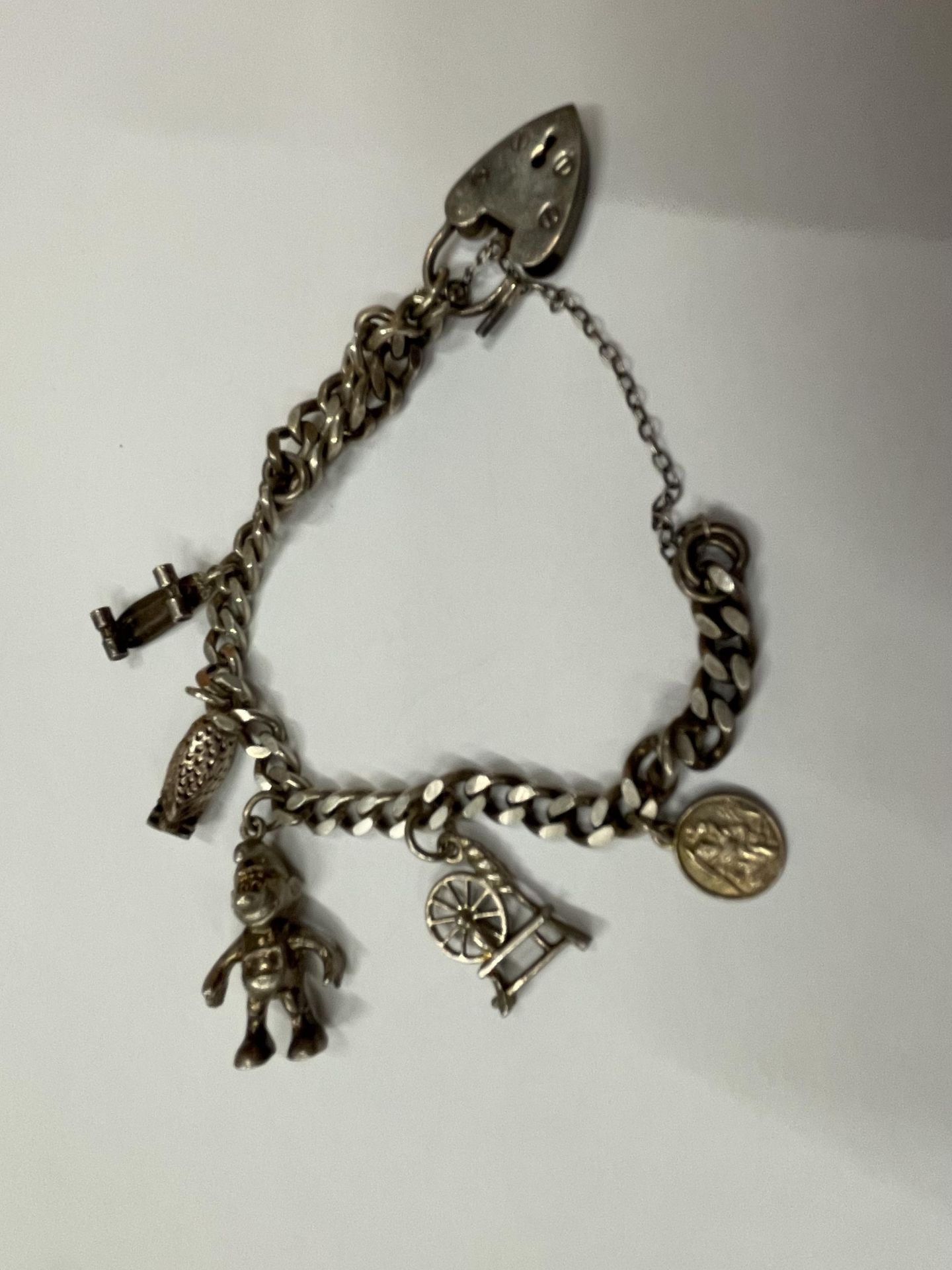 TWO SILVER BRACELETS TO INCLUDE A CHARM BRACELET WITH FIVE CHARMS AND A FIVE BAR GATE BRACELET - Image 3 of 3