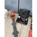 A FLYMO HEDGE TRIMMER AND A BATTERY DRILL