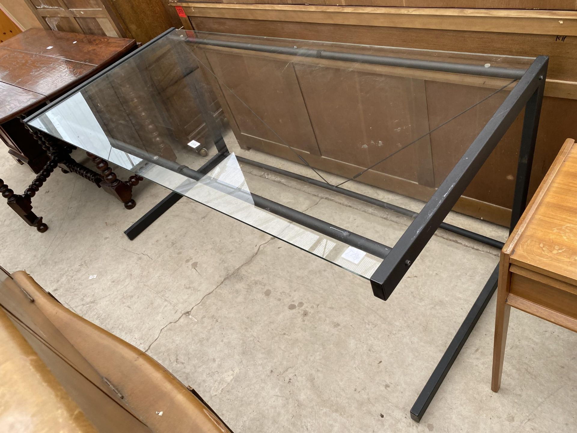 A MODERN GLASS TOP TABLE ON BLACK METALWARE FRAME 62" X 30" - Image 3 of 3