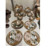AN ORIENTAL TEASET WITH TEA HOUSEDECORATION TO INCLUDE A TEAPOT, LIDDED JUG AND BOWL, CUPS AND