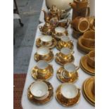 A GERMAN GILT COFFEE SET TO INCLUDE A COFFEE POT, CREAM JUG, SUGAR BOWL, CUPS AND SAUCERS