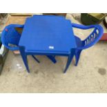 A PLASTIC CHILDS TABLE AND TWO CHAIRS