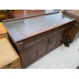 AN EARLY 20TH CENTURY OAK SIDEBOARD BY 'INGLESANTS OF LEICESTER', 56" WIDE