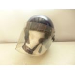 A POLICE RIOT HELMET AND FACE SHIELD