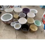 AN ASSORTMENT OF CERAMIC POTS AND PLANTERS