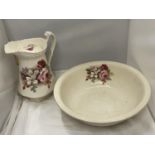 A LARGE TOILET JUG AND BOWL WITH FLORAL DECORATION