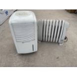 AN ELECTRIC HEATER AND A DEHUMIDIFIER