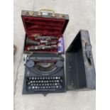 A VINTAGE CASED CLARINET AND AN OLIVER TYPEWRITER