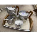 A PICQOUT WARE TEA SERVICE TO INCLUDE TEAPOT, COFFEE POT, MILK JUG SUGAR BOWL AND TRAY