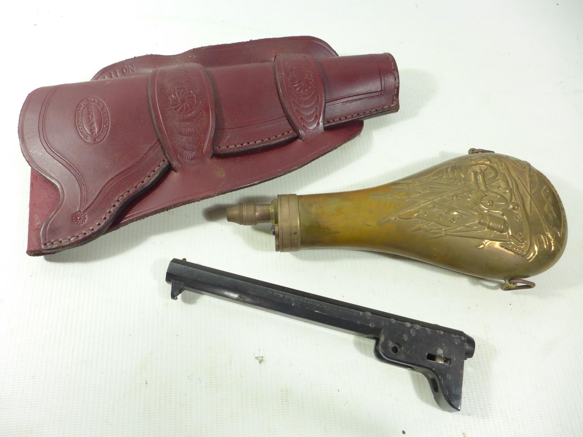 A COPPER AND BRASS POWDER FLASK, LEATHER HOLSTER AND A BLOCKED NAVY COLT BARREL (3)