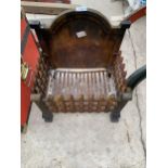 A VINTAGE CAST IRON FIRE GRATE