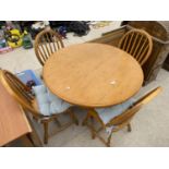 A MODERN 39" DIAMETER PEDESTAL DINING TABLE AND FOUR CHAIRS