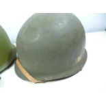 A GERMAN HELMET AND LINER AND A FURTHER METAL HELMET