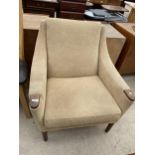 AN UPHOLSTERED 1970'S ARMCHAIR