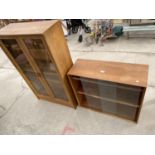 A 1970'S BOOKCASE WITH GLASS SLIDING DOORS, 32" WIDE