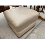 A MODERN LEATHER POUFFE