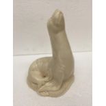 A VINTAGE BESWICK WARE UNPAINTED SEA LION FIGURE