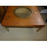 A HISTORIC COFFEE TABLE WITH INSET PORTHOLE RIM FROM SS CATILIAN SUNK AT SCAPA FLOW, THE GLASS IS