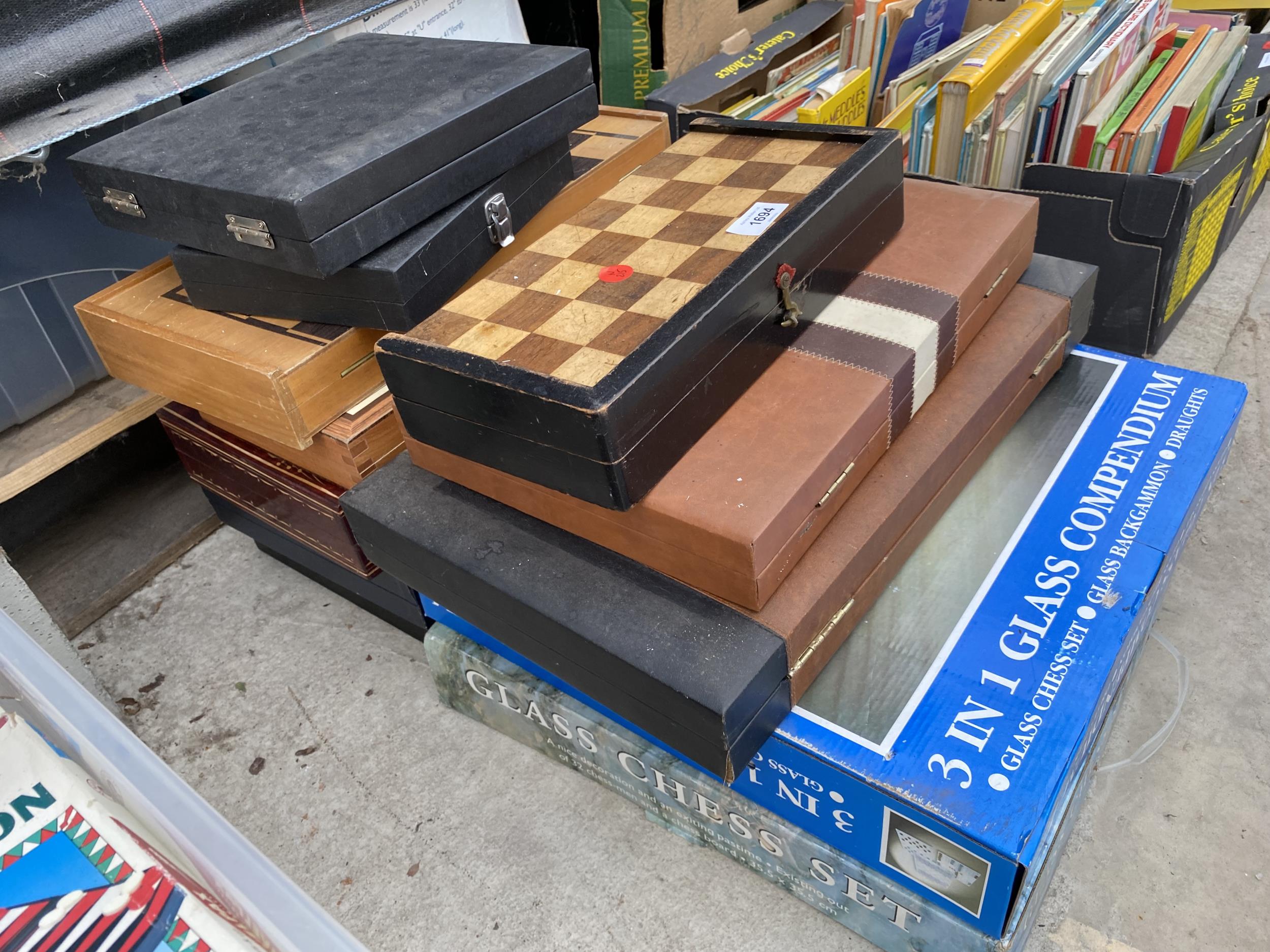 A LARGE COLLECTION OF CHESS BOARDS, CHESS PIECES AND BACKGAMON ETC