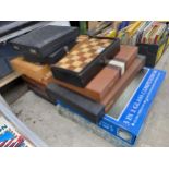 A LARGE COLLECTION OF CHESS BOARDS, CHESS PIECES AND BACKGAMON ETC
