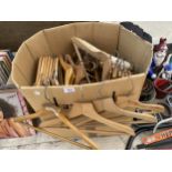 A LARGE QUANTITY OF WOODEN COAT HANGERS