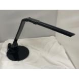 A BLACK ADJUSTABLE TABLE LAMP