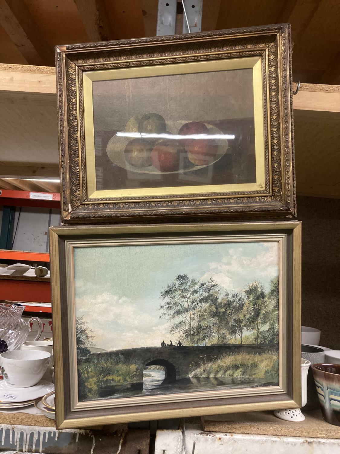 TWO FRAMED OIL PAINTINGS - STILL LIFE OF FRUIT AND A RIVER AND BRIDGE SCENE