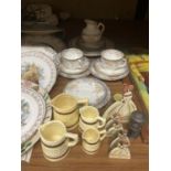 A CHINA TEASET WITH A BLUE AND YELLOW FLORAL PATTERN TO INCLUDE CUPS, SAUCERS, SIDE PLATES, A CAKE