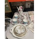 A QUANTITY OF CHINA TEAWARE TO INCLUDE A COFFEE POT AND SAUCERS WITH CAARNATION DECORATION,