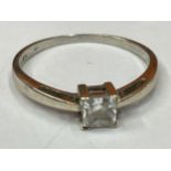 A 9 CARAT GOLD RING WITH A SQUARE SOLITAIRE STONE SIZE M/N