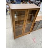 A MODERN TWO DOOR DISPLAY CABINET, 30" WIDE