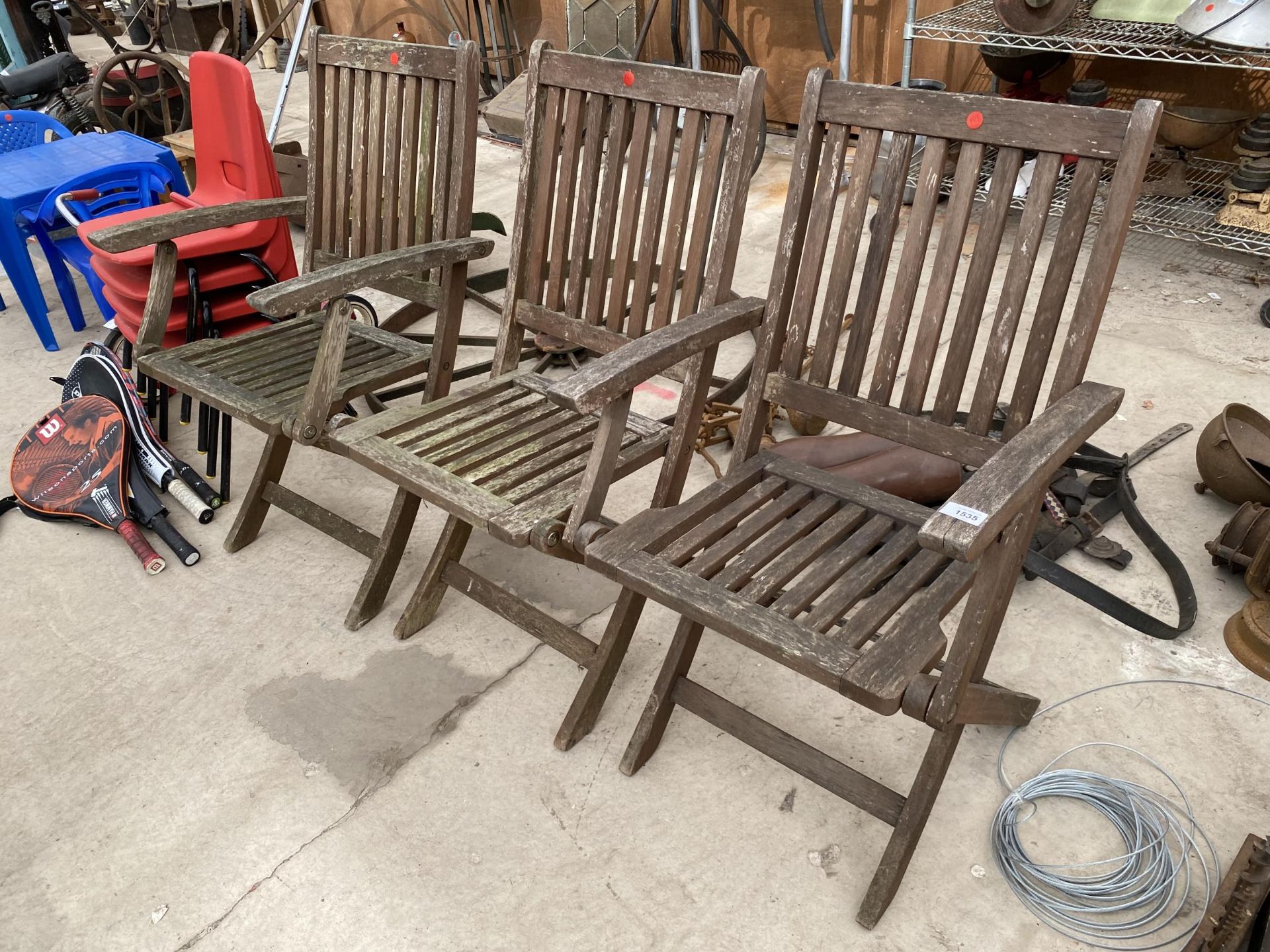 THREE TEAK FOLDING GARDEN CHAIRS